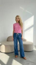 platėjantys džinsai moterims aukštu liemeniu mėlyni